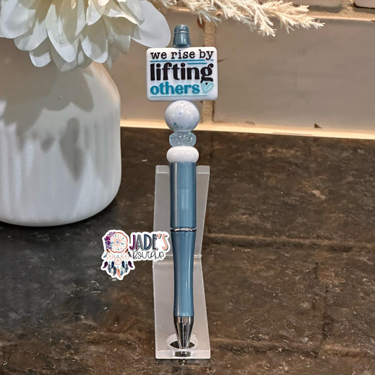 We Rise By Lifting Others Turquoise Pen